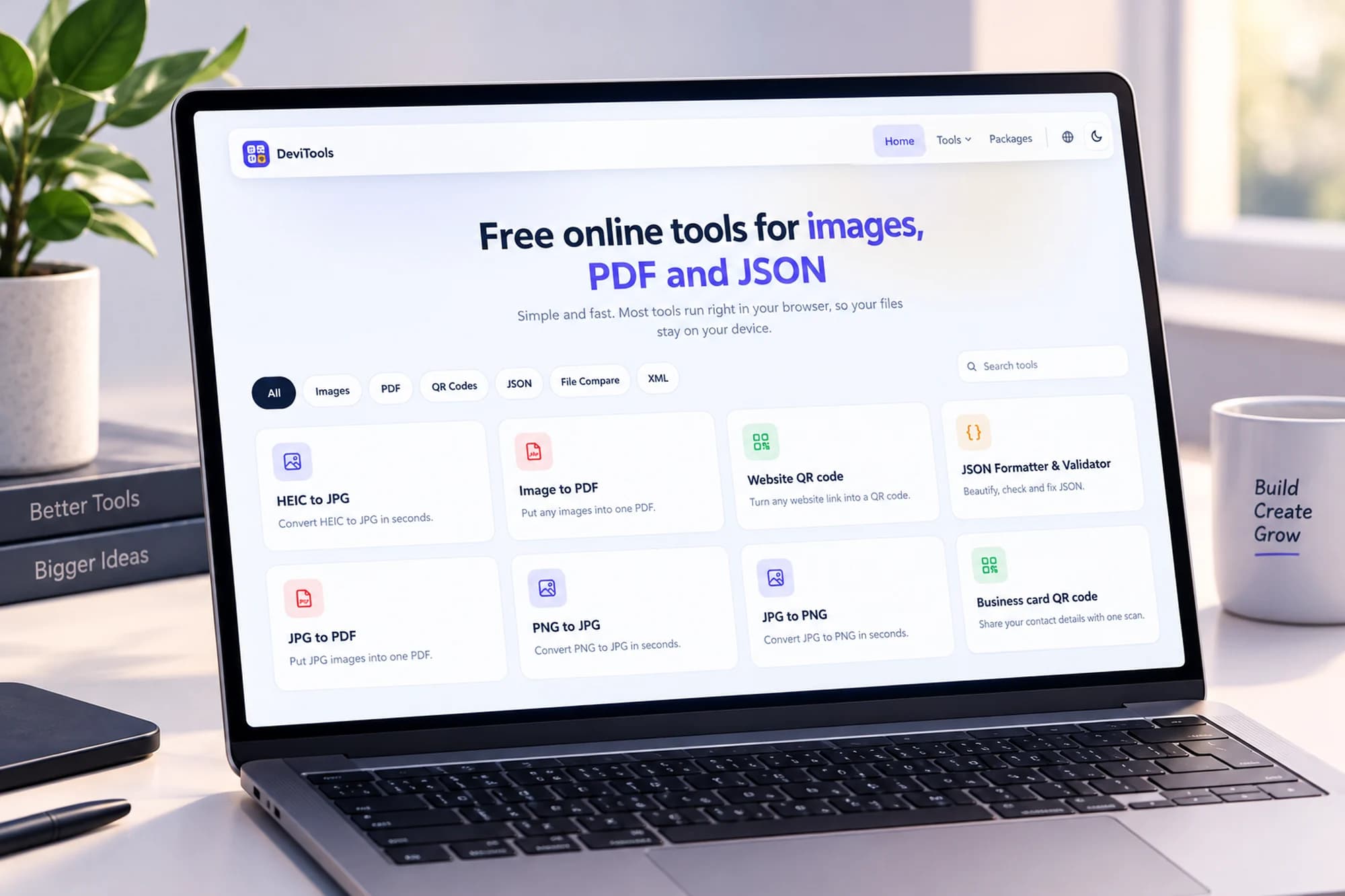 The DeviTools homepage open on a laptop, listing free browser-based tools for images, PDF, QR codes and JSON